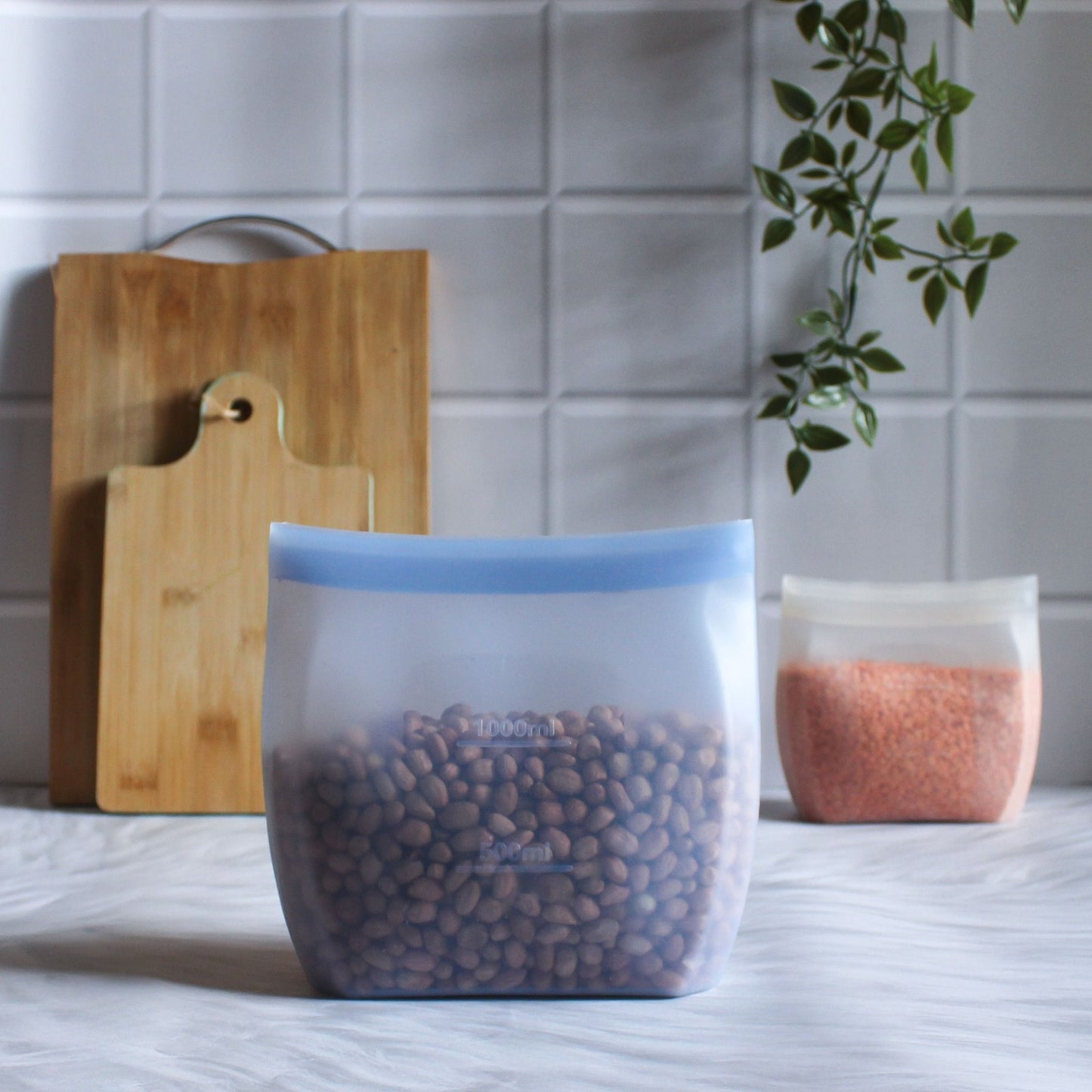 ZipNow Silicone Smart Bag being zipped shut with lentils inside