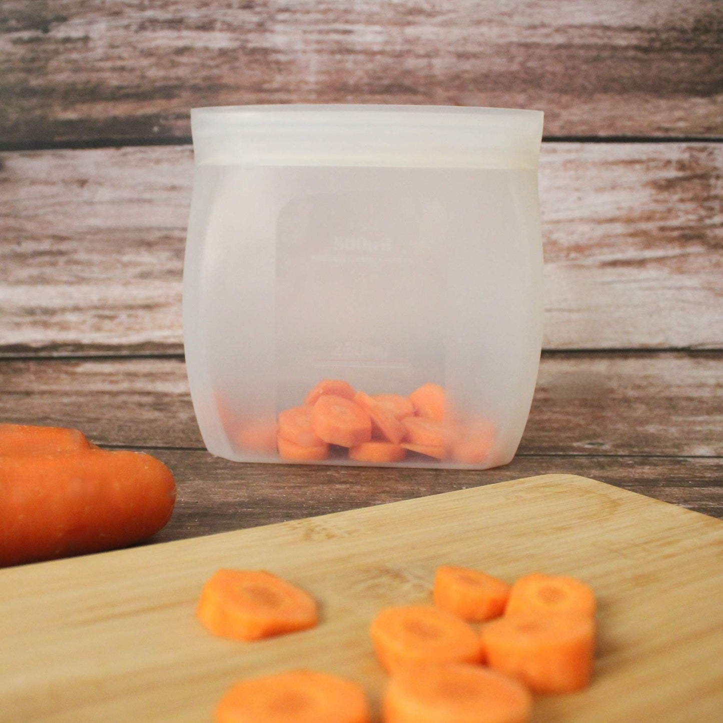 ZipNow Silicone Smart Bag on chopping board with sliced carrots