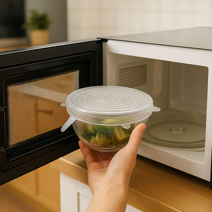 A hand placing a glass bowl sealed with a ZipNow silicone stretch lid into a microwave — demonstrating the lid’s microwave-safe and heat-resistant properties.
