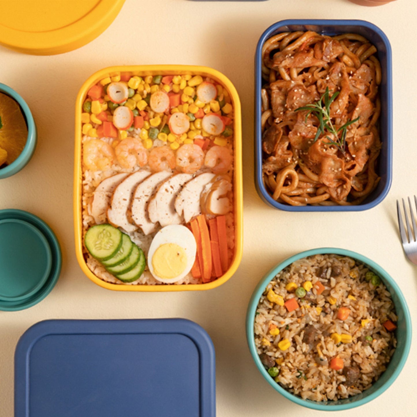 Colorful ZipNow silicone storage containers with rice, noodles, and salad
