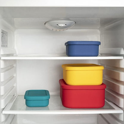 Stacked ZipNow silicone storage containers stored neatly in refrigerator
