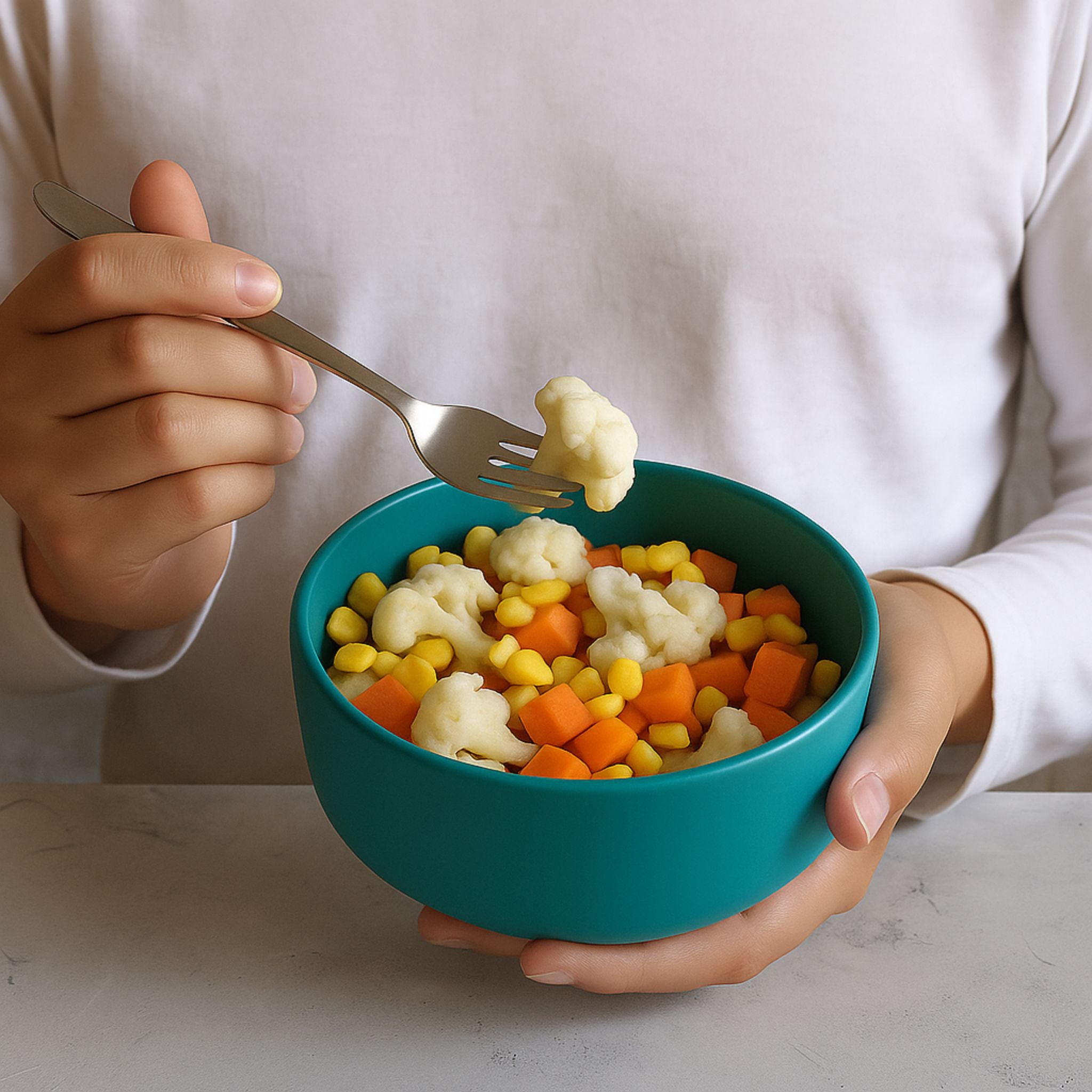 Person enjoying a healthy vegetable bowl in a teal ZipNow round container.
