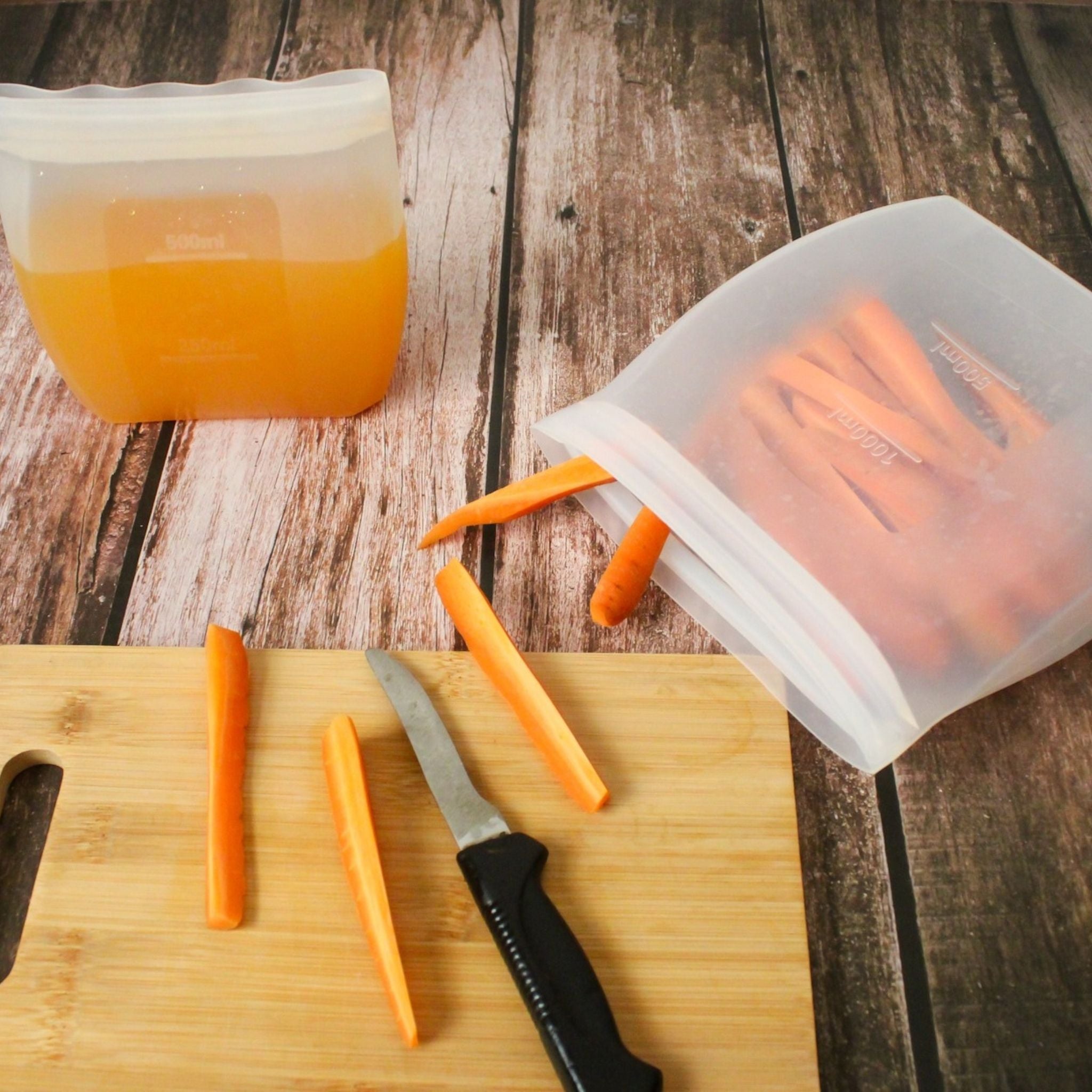 ZipNow Silicone Smart Bag storing juice and carrot sticks for meal prep
